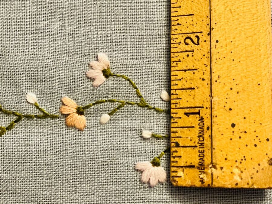 How to make a simple embroidered headband - embroidered piece with a ruler measuring the size